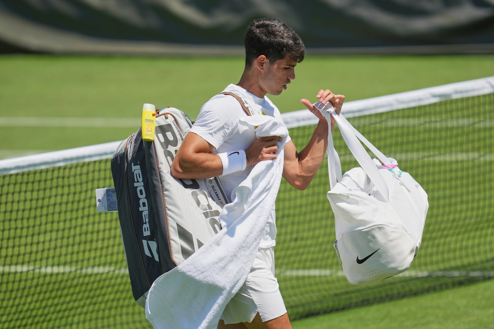 Carlos Alcaraz of Spain attends a practice session ahead of the Wimbledon Championships in London, Friday, June 27, 2025. (AP Photo/Kin Cheung)