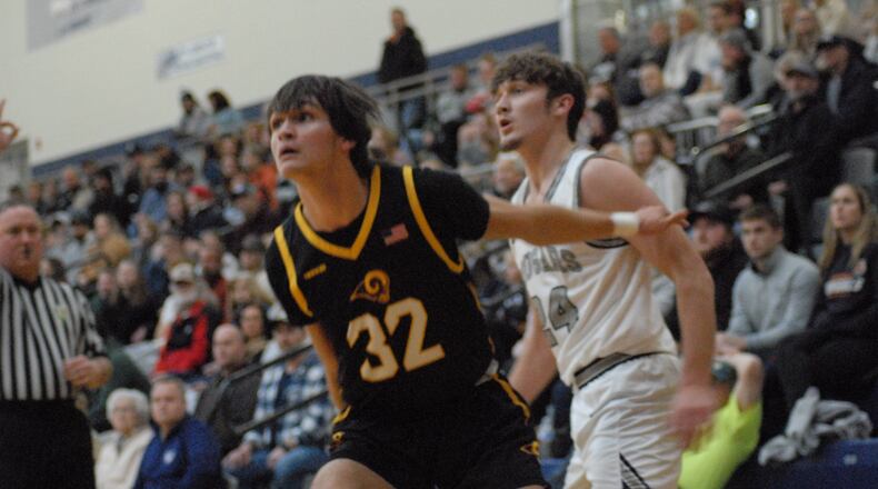 Ross senior Kellen Reid boxes out Edgewood junior Brayden Smith during a game on Jan. 6, 2023. Chris Vogt/CONTRIBUTED