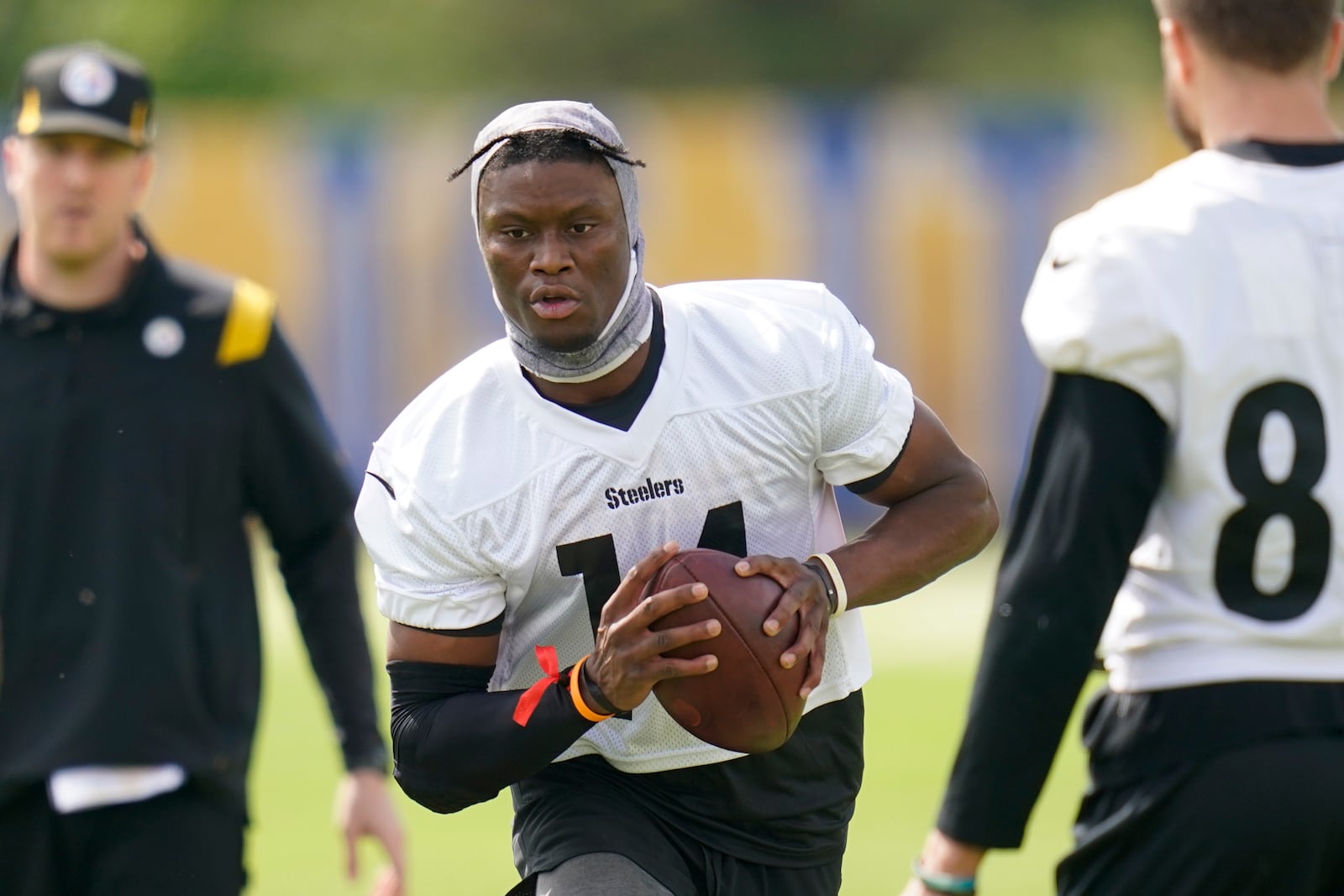 FILE - Pittsburgh Steelers wide receiver George Pickens, center, performs drills during an NFL football practice at rookie minicamp, Friday, May 13, 2022, in Pittsburgh. (AP Photo/Keith Srakocic, File)