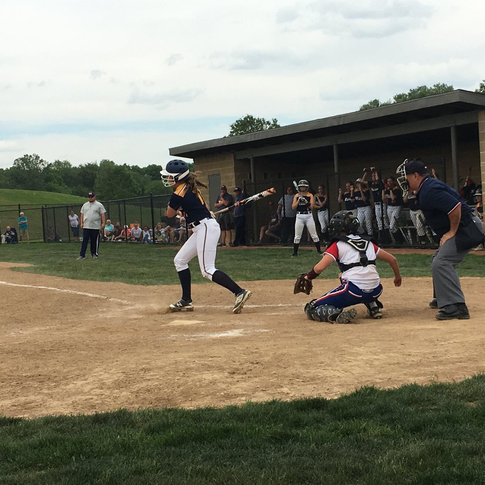 Monroe’s Faith Hensley singles in the fifth inning during Wednesday’s Division II sectional final against Clinton-Massie at Lefferson Park in Middletown. That’s the Falcons’ Hailey Clayborn behind the plate. RICK CASSANO/STAFF