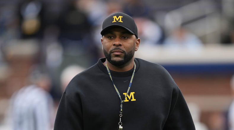 Michigan head coach Sherrone Moore watches during an NCAA college football spring game in Ann Arbor, Mich., Saturday, April 19, 2025. (AP Photo/Paul Sancya)