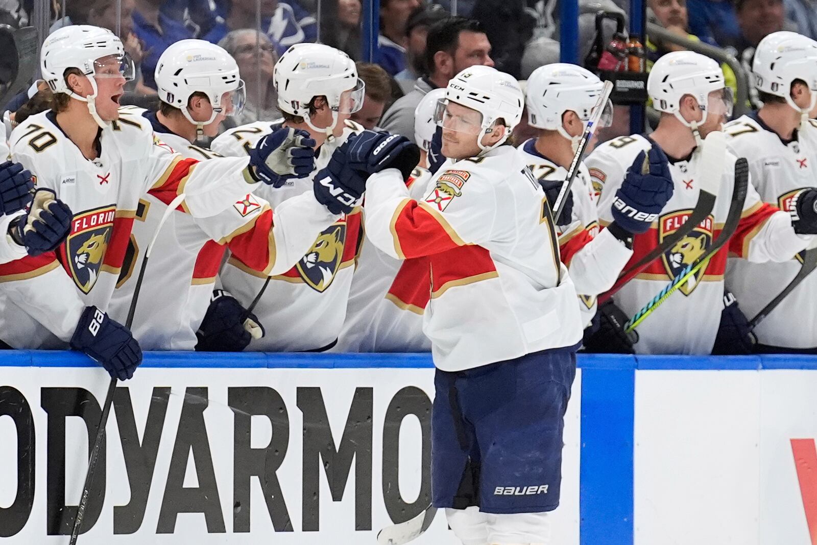 Florida Panthers left wing Matthew Tkachuk (19) celebrates with the bench after scoring against the Tampa Bay Lightning during the second period in Game 1 of an NHL hockey Stanley Cup first-round playoff series, Tuesday, April 22, 2025, in Tampa, Fla. (AP Photo/Chris O'Meara)