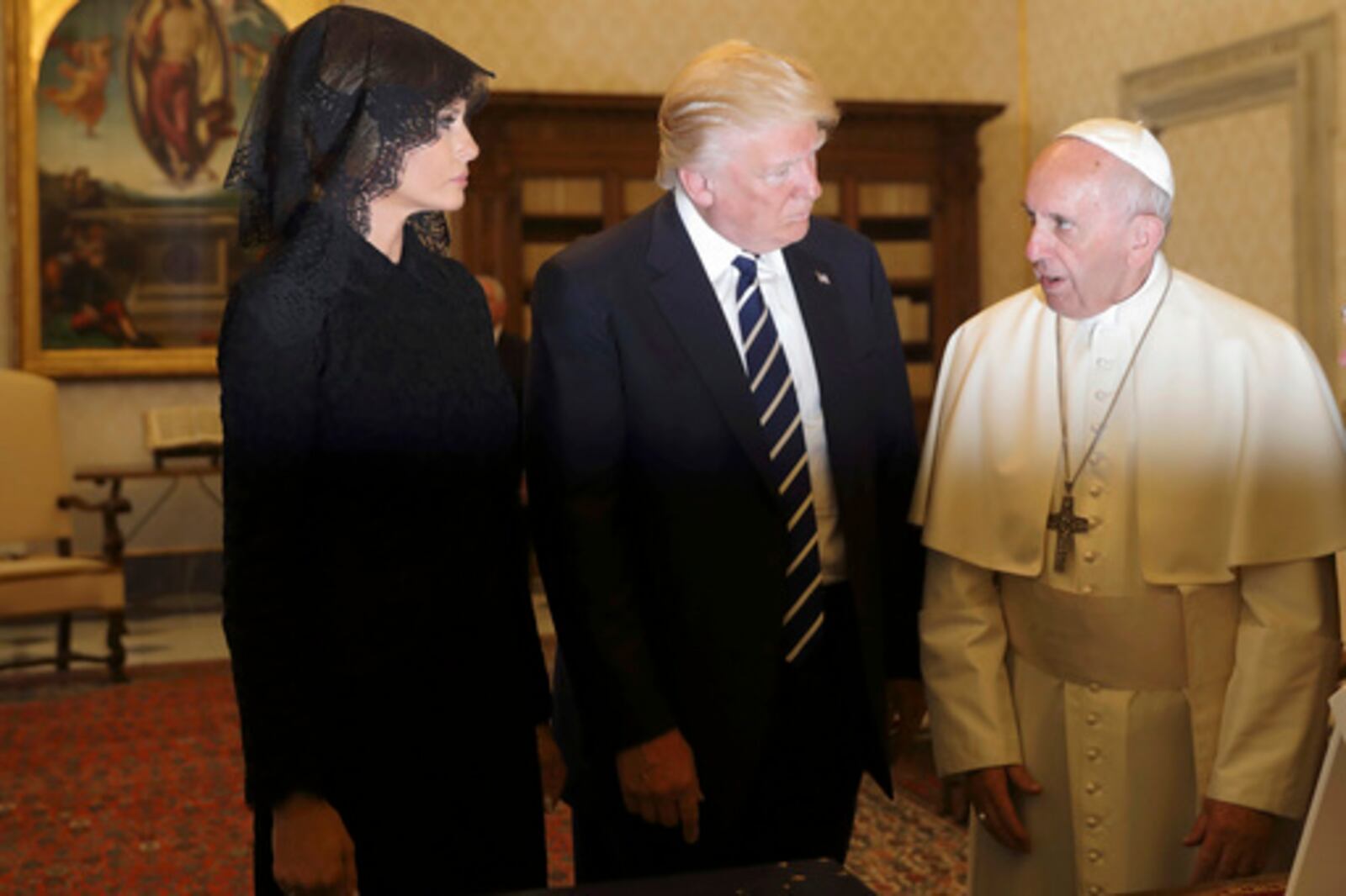 FILE - Pope Francis meets with US President Donald Trump and First lady Melania Trump on the occasion of their private audience, at the Vatican, Wednesday, May 24, 2017. (AP Photo/Alessandra Tarantino, Pool, file)