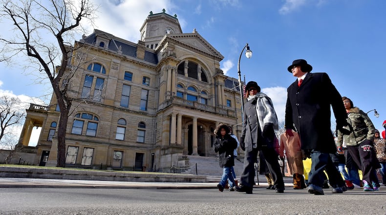 More than 60 people participated in the Hamilton Martin Luther King, Jr. day march Monday, Jan. 18, 2016. The march started at the Booker T. Washington Community Center and followed Front Street to High Street to S. Martin Luther King Jr. Boulevard to Ludlow Street where it ended at Payne Chapel AME Church. A service was conducted at the church after the march. NICK GRAHAM/FILE