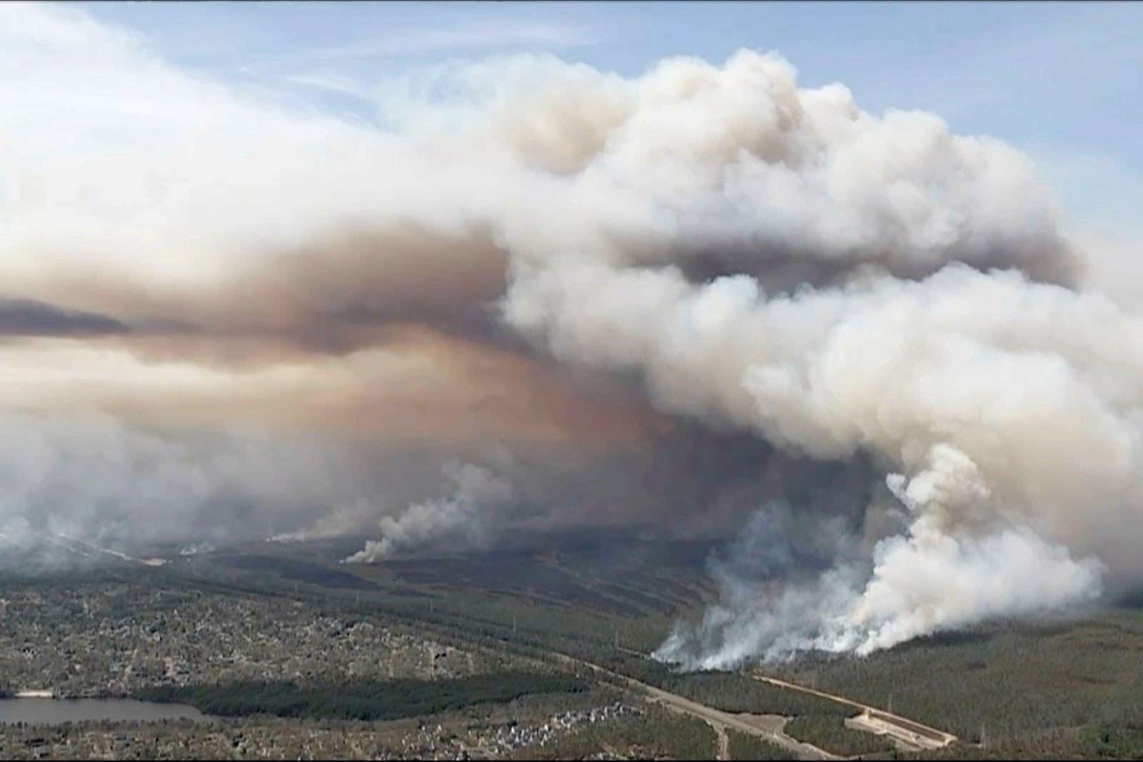 In this image taken from aerial video shows smoke rising from wildfires in Ocean County, N.J., Wednesday, April 23, 2025. (WPVI via AP)