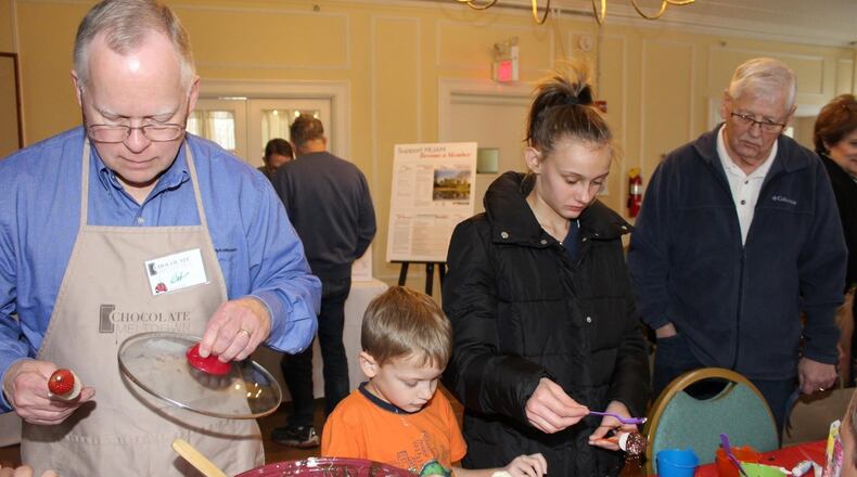 The Oxford Community Arts Center and the Miami University Art Museum will present Chocolate Meltdown from 1 to 5 p.m. Jan. 15 at the Oxford Community Arts Center. Children and adults alike enjoyed chocolate at a previous Chocolate Meltdown. CONTRIBUTED
