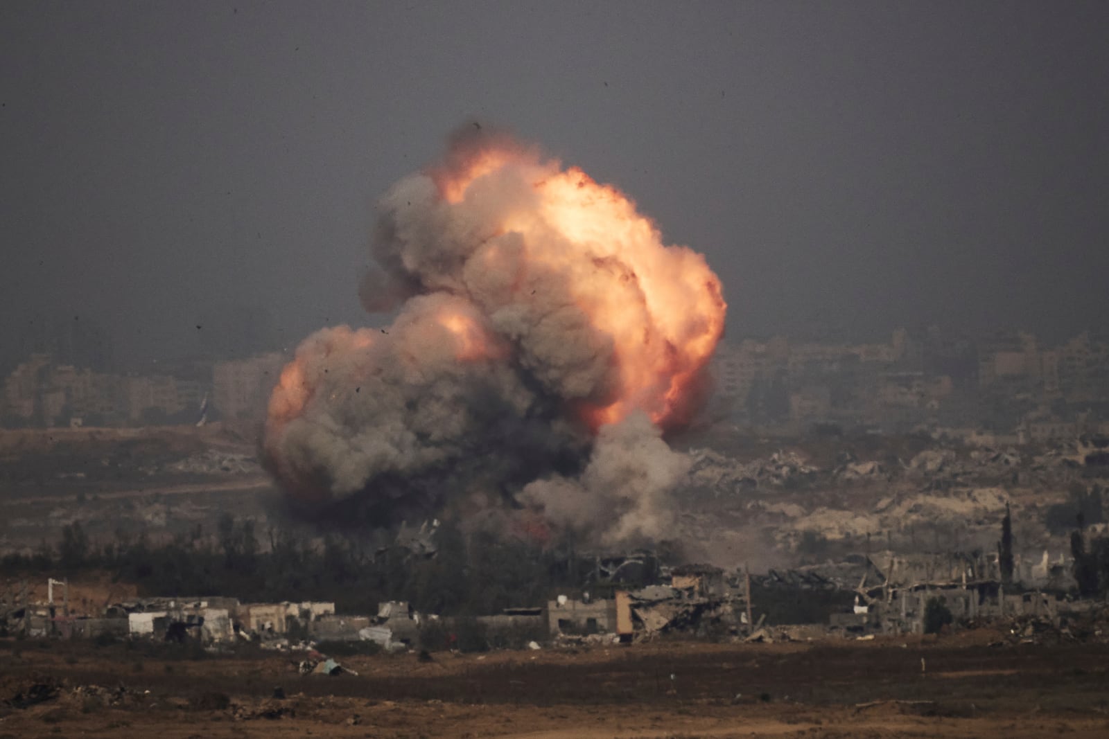 Smoke and fire rise to the sky following an Israeli army bombardment in the northern Gaza Strip, as seen from southern Israel, Thursday, July 10, 2025. (AP Photo/Leo Correa)