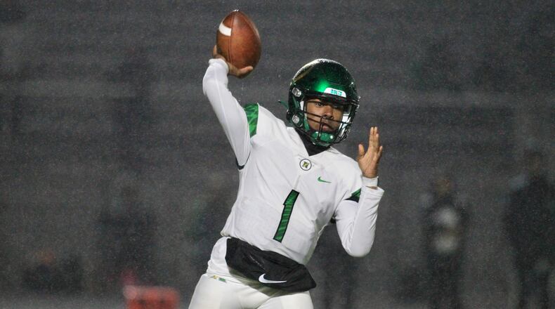 Northmont's Cahke' Cortner throws a pass against Springfield on Friday, Oct. 22, 2021, at Springfield. David Jablonski/Staff