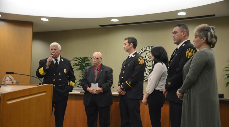 Fairfield Firefighters Daniel Korte and Jason Taulbee are promoted to lieutenant on Monday, Nov. 26. Pictured is Fairfield Fire Chief Don Bennett talking before the oath of office ceremony. Also pictured are Fairfield Councilman Ron D’Epifanio, and Korte (center) and Taulbee (second from right) with their wives. Part of the public oath of office ceremony is to have a family member pin the badge on the person taking the oath.