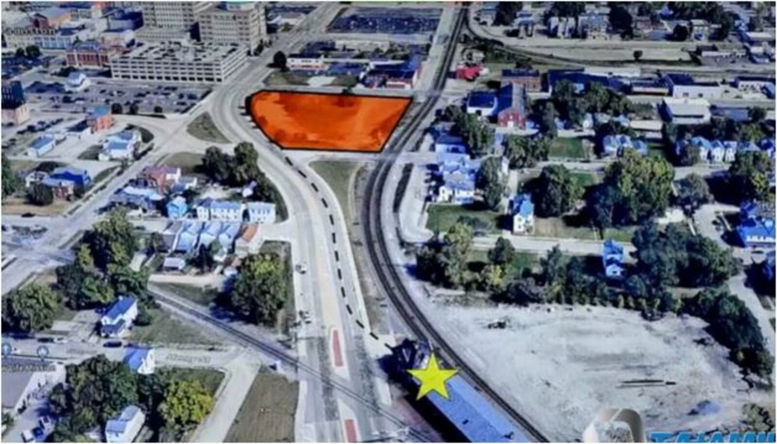 The orange area is the nearby city-owned property along Martin Luther King Boulevard where Hamilton's historic CSX station would be moved. The yellow star shows where the station now is located. PROVIDED
