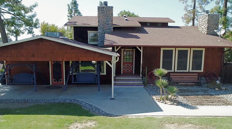 Karen Perez's Hanford home has been added on and made to look like an old west ranch home reminiscent of "Bonanza," much of it done by herself, as seen on Wednesday, Sept. 27, 2017. (Craig Kohlruss/Fresno Bee/TNS)
