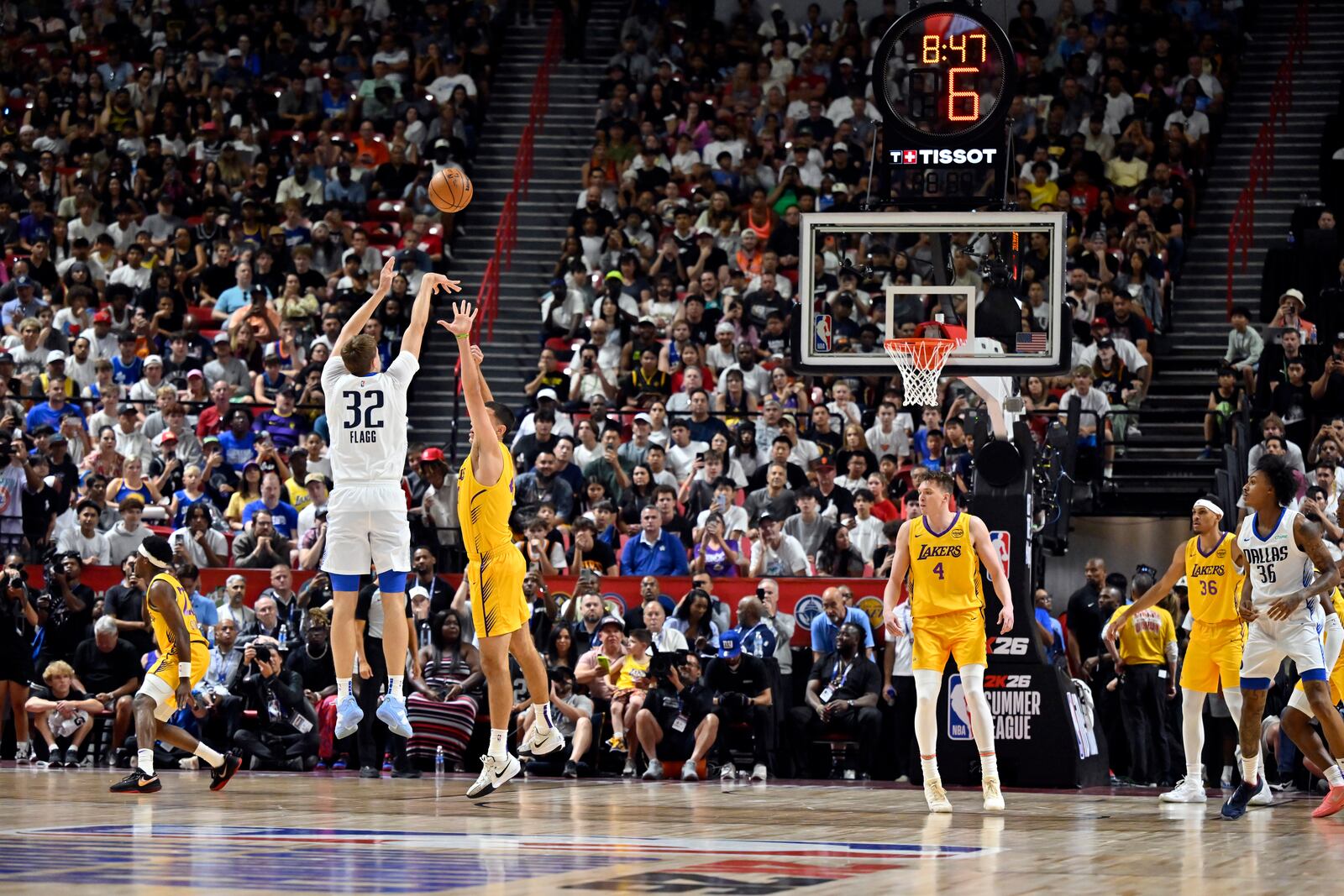 Dallas Mavericks forward Cooper Flagg (32) attempts a three-point basket against the Los Angeles Lakers during the first half of an NBA summer league basketball game Thursday, July 10, 2025, in Las Vegas. (AP Photo/David Becker)