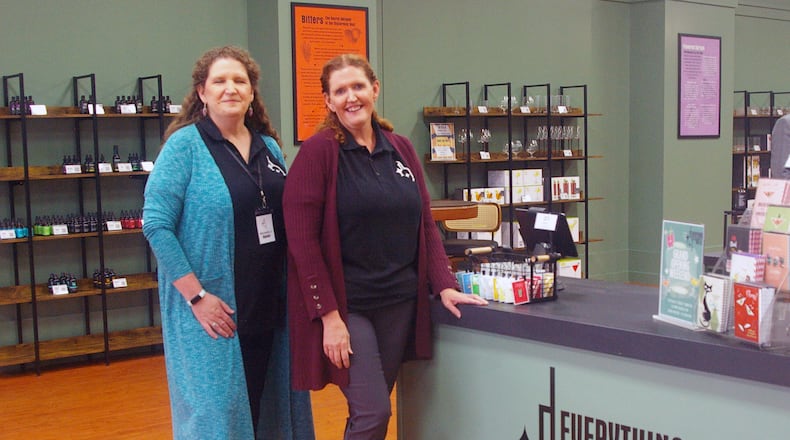 Sisters Michelle Juergens and Krista Hepp are the co-owners of Everything But the Bottle in the Bridgewater Falls shopping center in Fairfield Twp. SUE KIESEWETTER/CONTRIBUTED