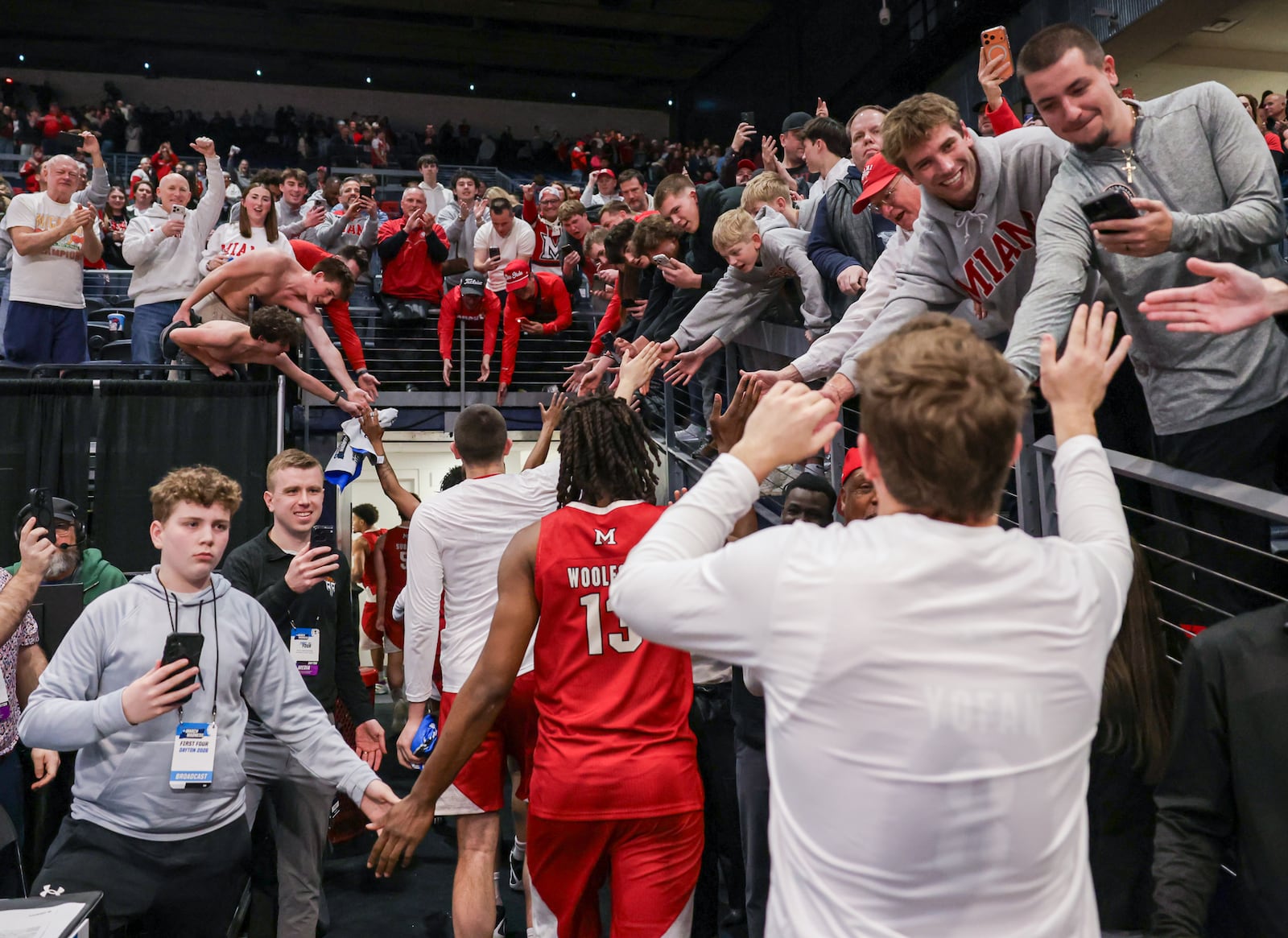 Miami fans cheer and clap hands with players following an 89-79 win over Southern Methodist in an NCAA First Four game on Wednesday, March 18 at University of Dayton Arena. BRYANT BILLING / STAFF