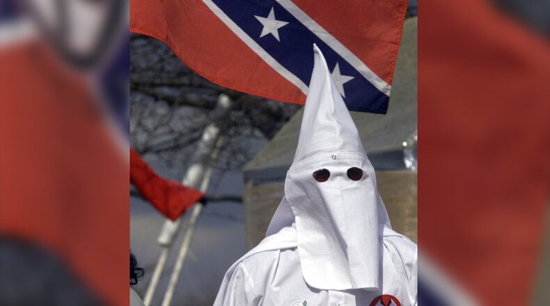 A Ku Klux Klan member stands on the stairs of the Kettering Government Center during a 2005 rally.