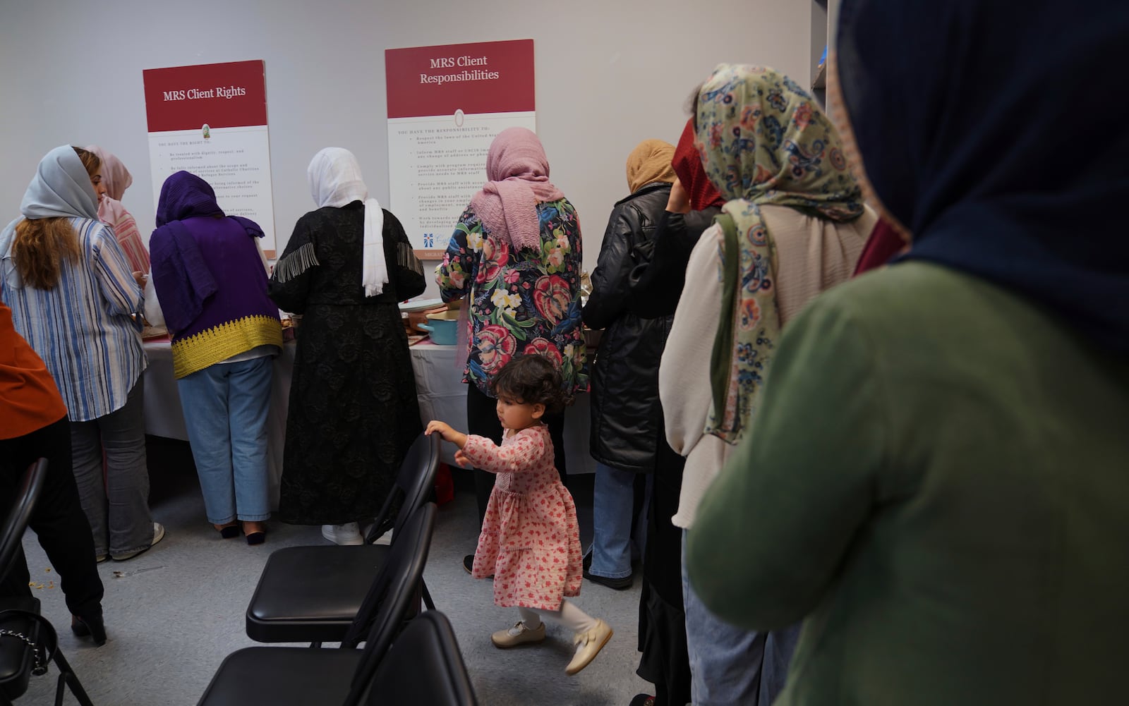 A group of female Afghan refugees gather for a class on self-care and a post-Ramadan celebration at Catholic Charities Migrant and Refugee Services office in Fredericksburg, Va., on Tuesday, April 8, 2025. (AP Photo/Jessie Wardarski)