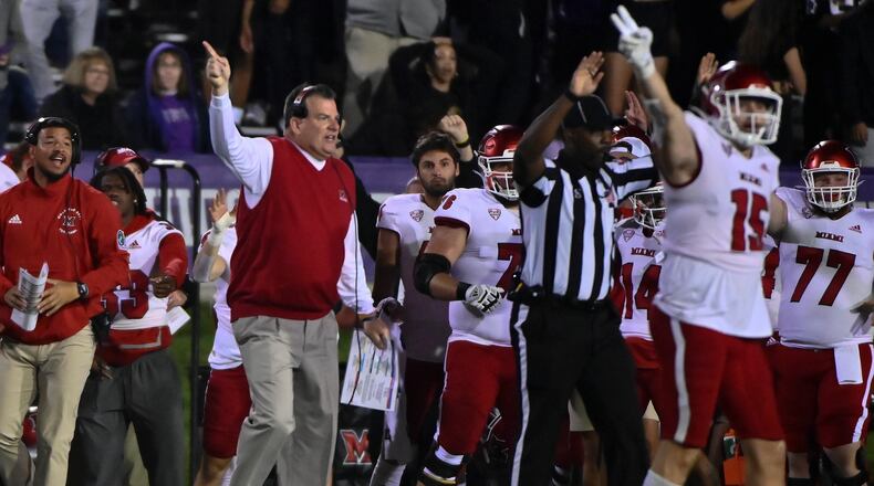 Miami (Ohio) coach Chuck Martin, front left, reacts during the second half of the team's NCAA college football game against Northwestern, Saturday, Sept. 24, 2022, in Evanston, Ill. (AP Photo/Matt Marton)
