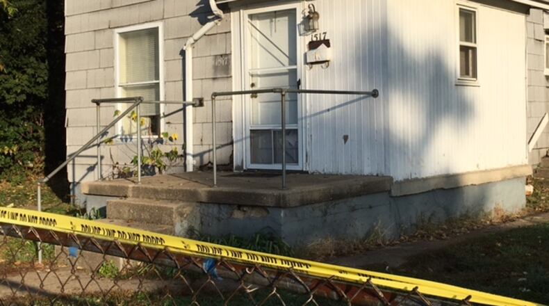 Crime scene tape wrapped aound the fence in front of the Lafayette Avenue home where Joseph Ramano was found dead Friday morning. LAUREN PACK/STAFF