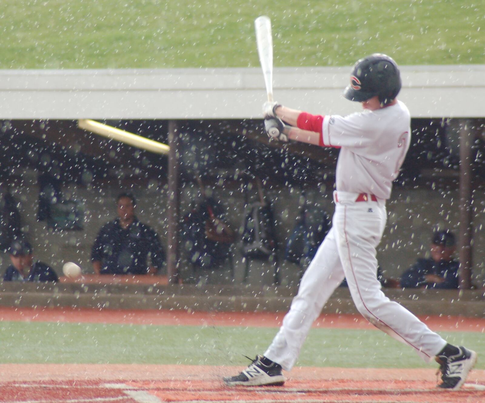 Carlisle’s Caleb Stewart takes a swing in the rain Thursday during a Division III regional semifinal against Cincinnati Country Day at the Athletes in Action complex in Xenia. CONTRIBUTED PHOTO BY JOHN CUMMINGS