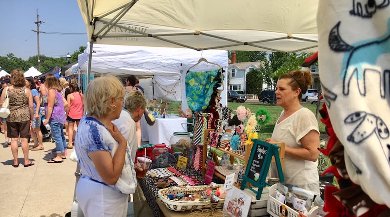 The Hamilton Flea market attracts lots of shoppers and people hanging out listening to live music and eating at various food trucks. It is open on the second Saturday of each month through the Summer season at Marcum Park in downtown Hamilton. FILE PHOTO