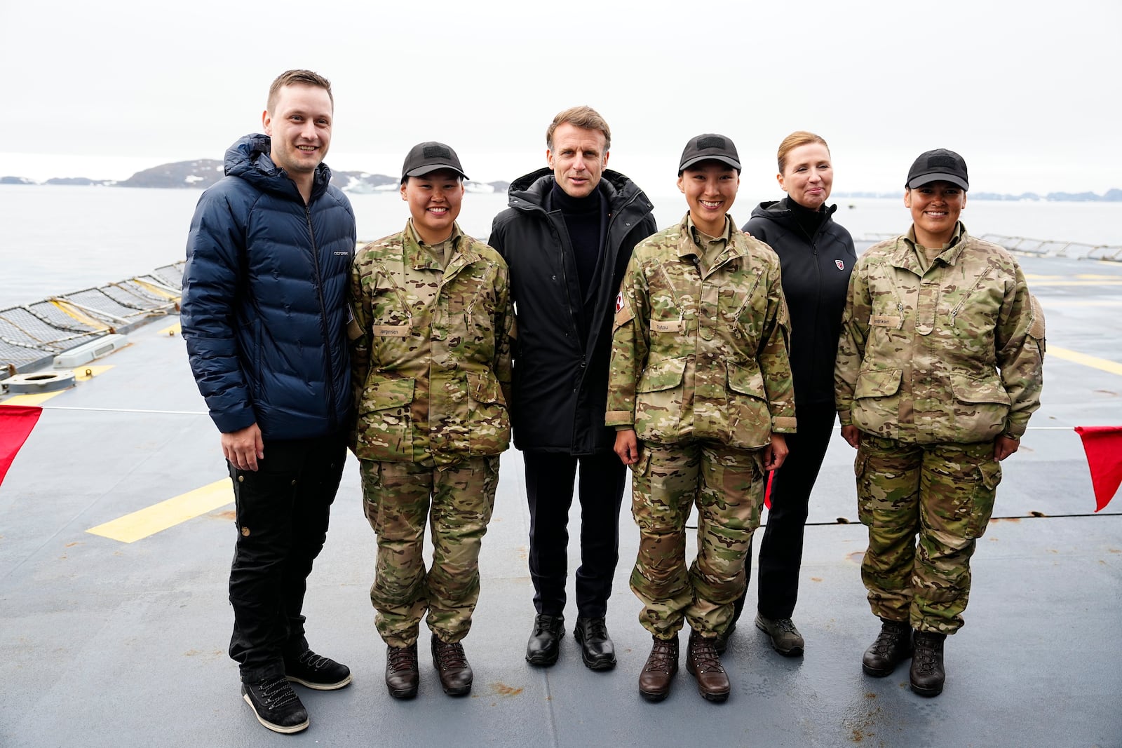 French President Emmanuel Macron, center, Danish Prime Minister Mette Frederiksen, 2nd right, and Greenlandic leader Jens-Frederik Nielsen aboard the Danish frigate F363 Niels Juel in Nuuk, Greenland, Sunday, June 15, 2025.(Mads Claus Rasmussen/Ritzau Scanpix via AP)