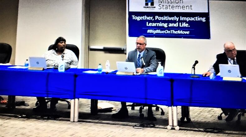 The governing board of the 10,000-student Hamilton Schools announced during its Thursday meeting it "has no interest in mandating Covid-19 vaccination for students or staff." Board President Laurin Sprague (center) did add, however, if ordered by governmental entities outside the district, the schools may have to adopt such a mandate. (Photo By Michael D. Clark\Journal-News)