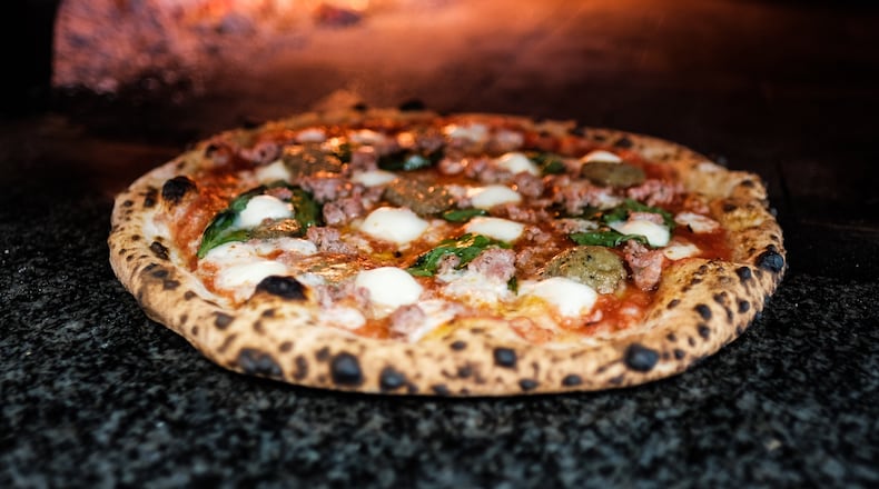 Old Scratch Pizza reopens its Dayton restaurant Tuesday, Aug. 25 after a brief closure due to employee's positive COVID-19 test. CONTRIBUTED