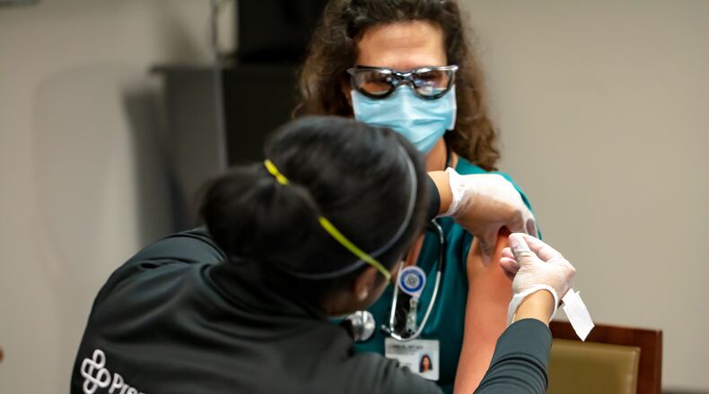 The first dose of the Moderna coronavirus vaccine (a two-dose regimen) is administered to frontline health care workers at Miami Valley Hospital. Photo provided by Premier Health.