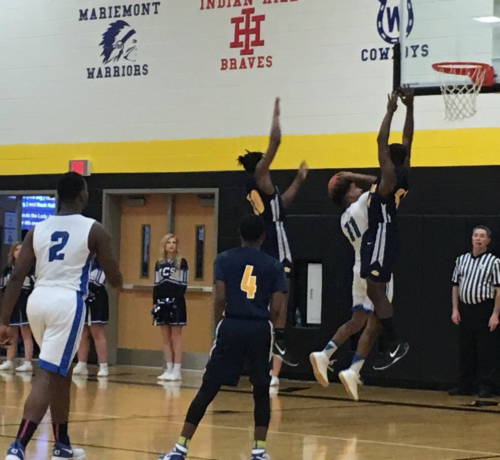 Middletown Christian’s C.J. Money (11) tries to get to the basket between two Cincinnati College Prep Academy defenders Saturday night during a Division IV sectional final at Taylor. RICK CASSANO/STAFF