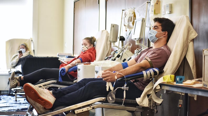 Miami University senior Will Vandeveer donates plasma during a Convalescent Plasma Drive hosted by Hoxworth Blood Center and Miami University on Wednesday, Oct. 28, 2020 at Miami University's Armstrong Student Center in Oxford. NICK GRAHAM / STAFF