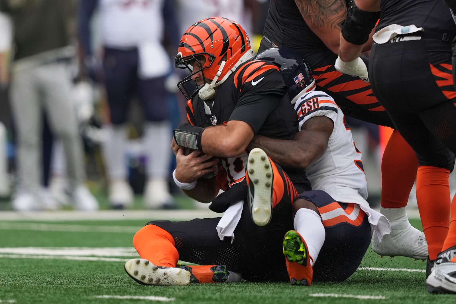 Chicago Bears running back Deion Hankins (35) brings down Cincinnati Bengals quarterback Joe Flacco (16) during the first half of an NFL football game, Sunday, Nov. 2, 2025, in Cincinnati. (AP Photo/Joshua A. Bickel)