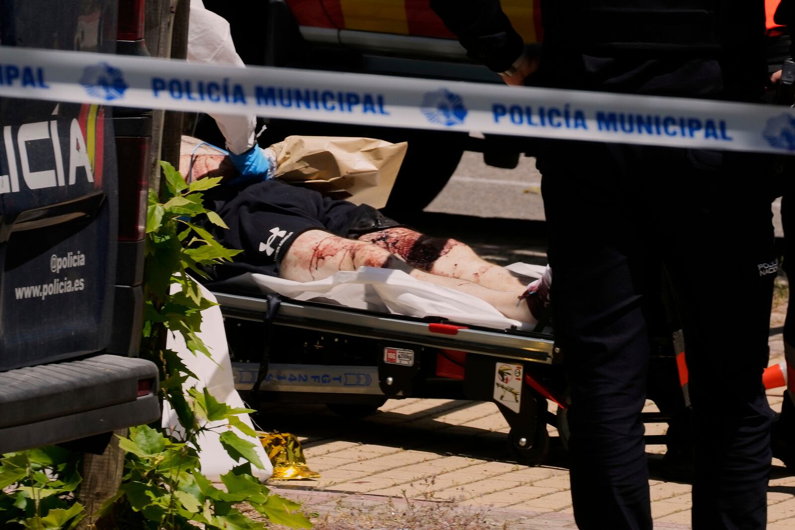 A view of the scene after Andriy Portnov, an adviser to former Ukrainian president Viktor Yanukovych, was shot, outside a school in Madrid, Spain, Wednesday, May 21, 2025. (AP Photo/Paul White)