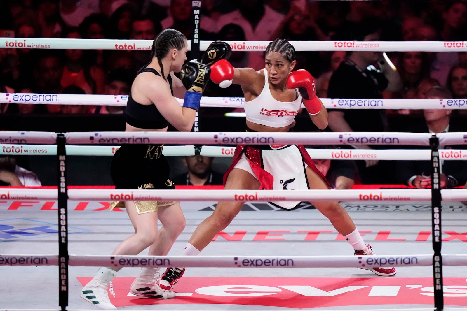 Puerto Rico's Amanda Serrano, right, punches Ireland's Katie Taylor during the second round of a super lightweight championship boxing match Friday, July 11, 2025, in New York. (AP Photo/Frank Franklin II)