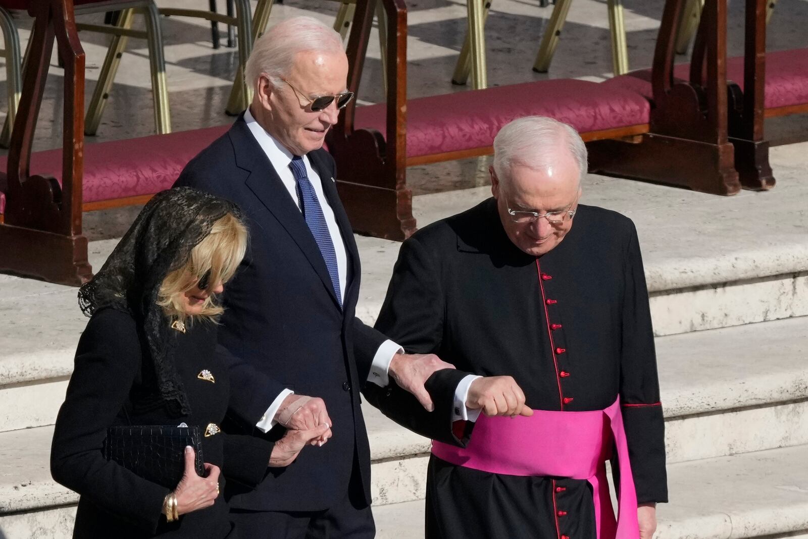 Former President Joe Biden, center, and his wife Jill arrive for the funeral of Pope Francis in St. Peter's Square at the Vatican, Saturday, April 26, 2025. (AP Photo/Gregorio Borgia)