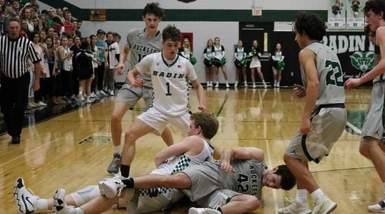 Badin’s Justin Pappas gets on the ground and fights for the ball with Josh Burkhardt (42) of McNicholas during Friday night’s game at Mulcahey Gym in Hamilton. McNick won 47-45. CONTRIBUTED PHOTO BY TERRI ADAMS