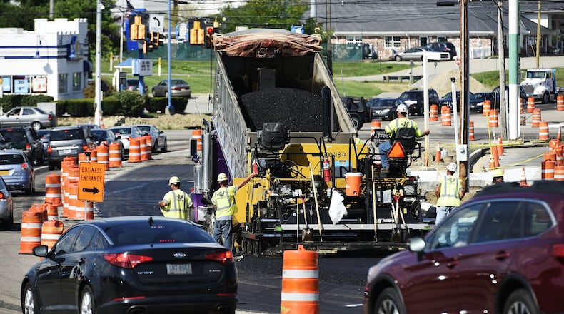 FILE PHOTO: Crews pave a section of South Gilmore Road at Ohio 4 in Fairfield in 2018.