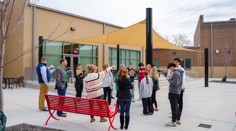 Monroe school officials are using a novel approach - as they prepare to design and build a new high school - by taking current students on architectural tours of other school buildings to get their feedback. This week saw Monroe school officials bus more than a dozen Monroe High School students to three newer school buildings in Warren County – Carlisle Junior/Senior High School, Franklin and Lebanon high schools - to get their opinions on what features most appealed to them. Students pictured at Franklin's courtyard area. (Provided)