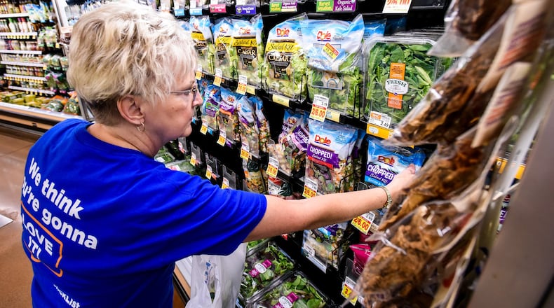 Carol Spencer collects an online grocery order for the Clicklist store pickup at Kroger Marketplace. Customers can order their groceries online and pay and get their order loaded into their car by Kroger staff. NICK GRAHAM/STAFF