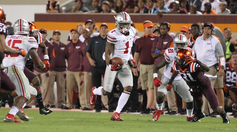 Ohio State's Braxton Miller prepares to make a spin move to break free on a 53-yard touchdown run in the third quarter against Virginia Tech on Monday, Sept. 7, 2015, at Lane Stadium in Blacksburg, Va. David Jablonski/Staff