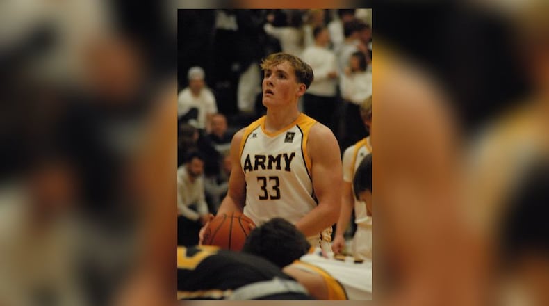 Talawanda senior Logan Smith eyes the basket during a free throw attempt against on Tuesday, Dec. 20. Both teams wore Army uniforms in salute to the armed services. Chris Vogt/CONTRIBUTED