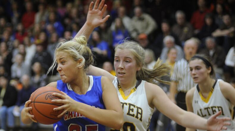 Carroll’s Amanda Schroeder (with ball) secures a rebound from Alter’s Emily Long. Alter finished No. 2 in the final D-II state poll and GCL Co-Ed North rival Carroll No. 7. MARC PENDLETON / STAFF
