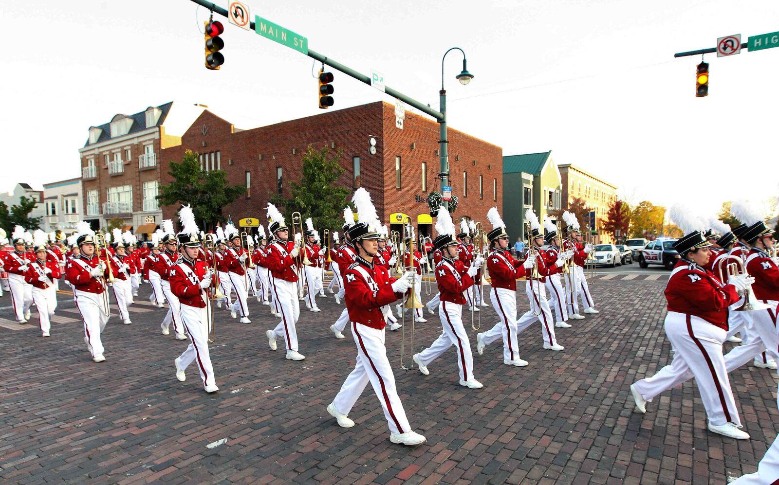 Miami University's marching band performs during the school's homecoming parade along High Street in Oxford Friday, Oct. 18, 2013. NICK DAGGY / STAFF