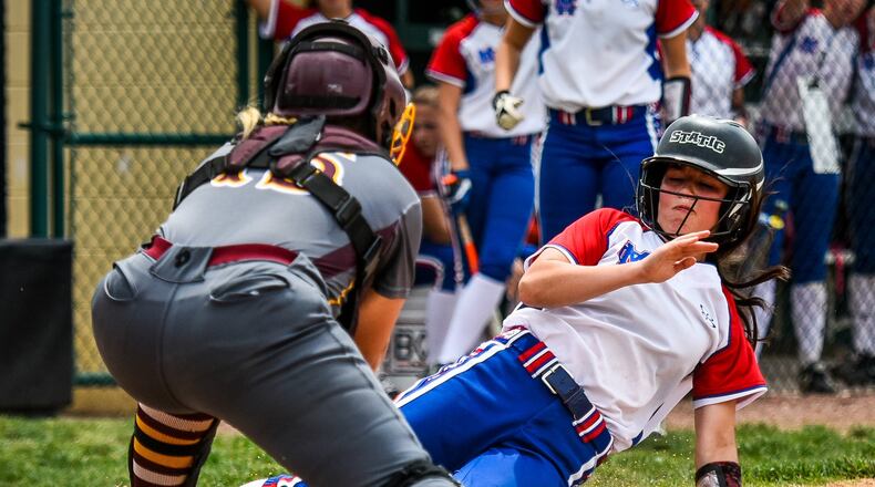Clinton-Massie’s Kendall Anderson is tagged out by Ross catcher Whitley Arno during their Division II district final Friday at Mason. NICK GRAHAM/STAFF