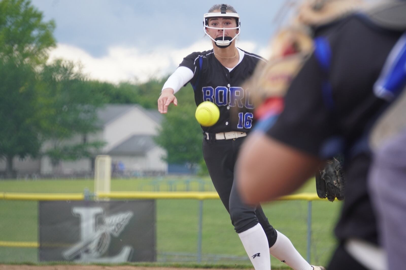 Springboro High School's Katie Jonas sends a pitch to the plate during a Division I district final game against Mason on Thursday at Lebanon High School. CHRIS VOGT / CONTRIBUTED