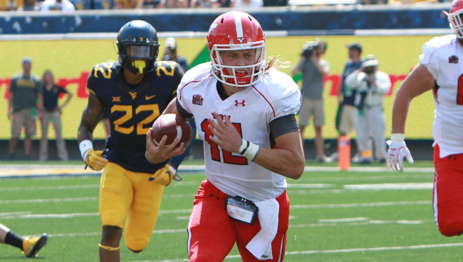 Ricky Davis, shown in action for Youngstown State at West Virginia on Sept. 10, 2016, threw for 1,532 yards and 11 touchdowns during his YSU career. PHOTO BY RON STEVENS/YSU ATHLETICS