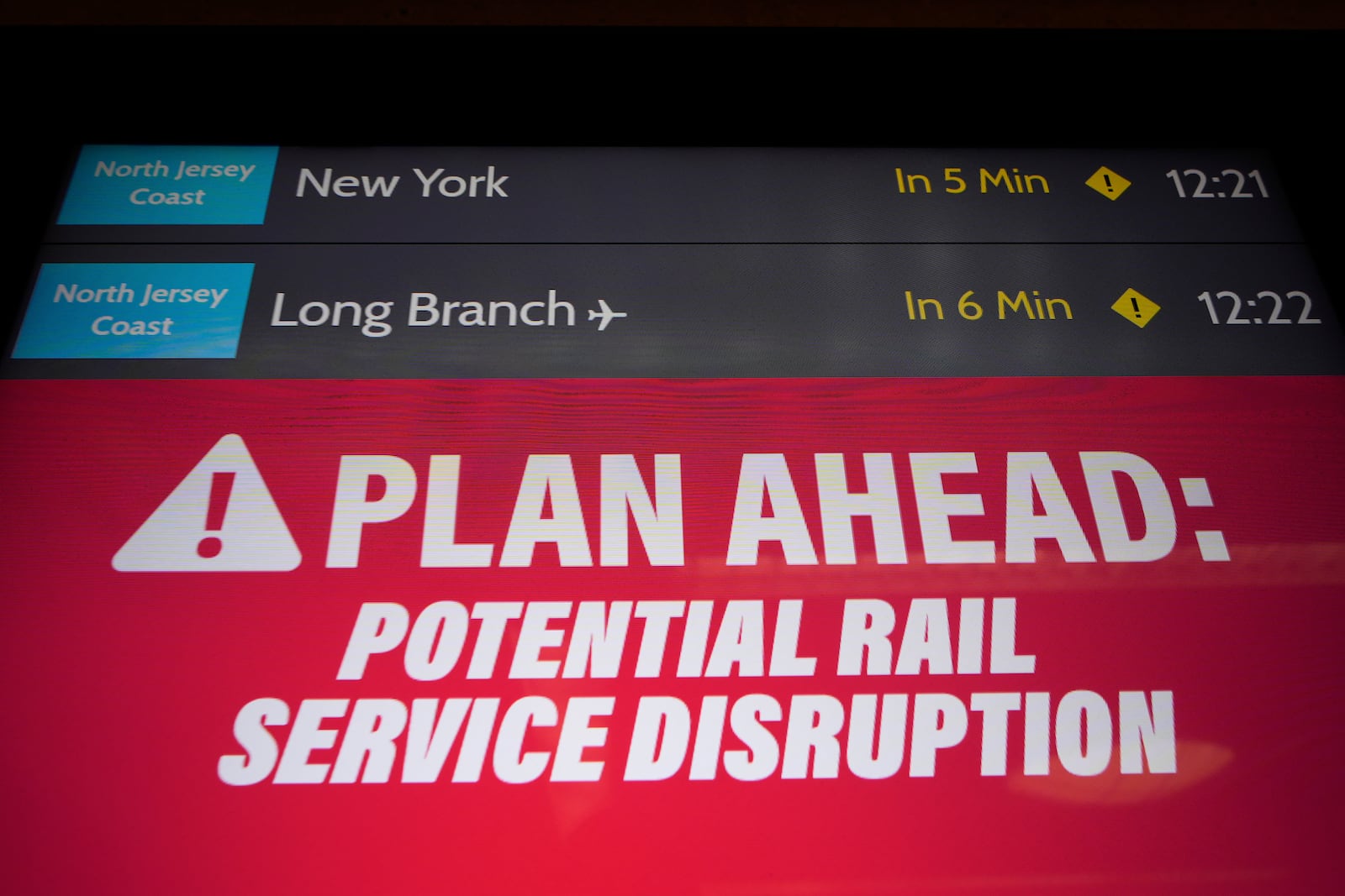 An electronic display advises commuters of potential NJ Transit service disruptions at the Secaucus Junction station in Secaucus, N.J., Wednesday, May 14, 2025. (AP Photo/Seth Wenig)