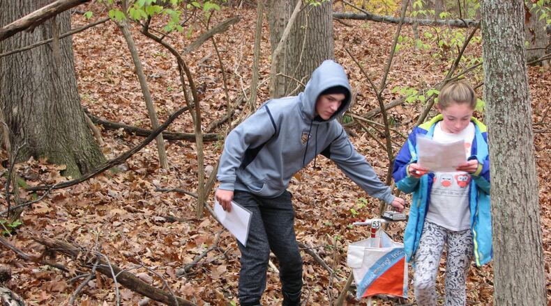 Young orienteers visit a control point. MIKE MINIUM/CONTRIBUTED