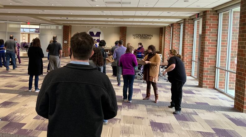 Late last week saw hundreds of area school teachers line up for their second coronavirus vaccine injection - pictured are Middletown school staffers at the high school on Friday - as area districts are increasingly optimistic school life is headed toward more normalcy. It's been almost a year since all Ohio K-12 schools were closed by the state in reaction to the onset of the pandemic. (Provided Photo\Journal-News)