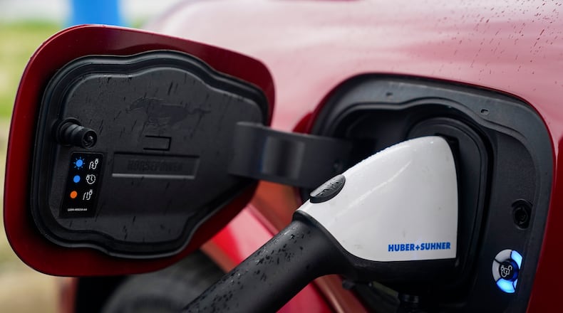 Effective immediately, Liberty Twp. is restricting locations for electric vehicle charging stations, prohibiting them in garages under multi-family buildings. 
FILE - AP Photo/Joshua A. Bickel