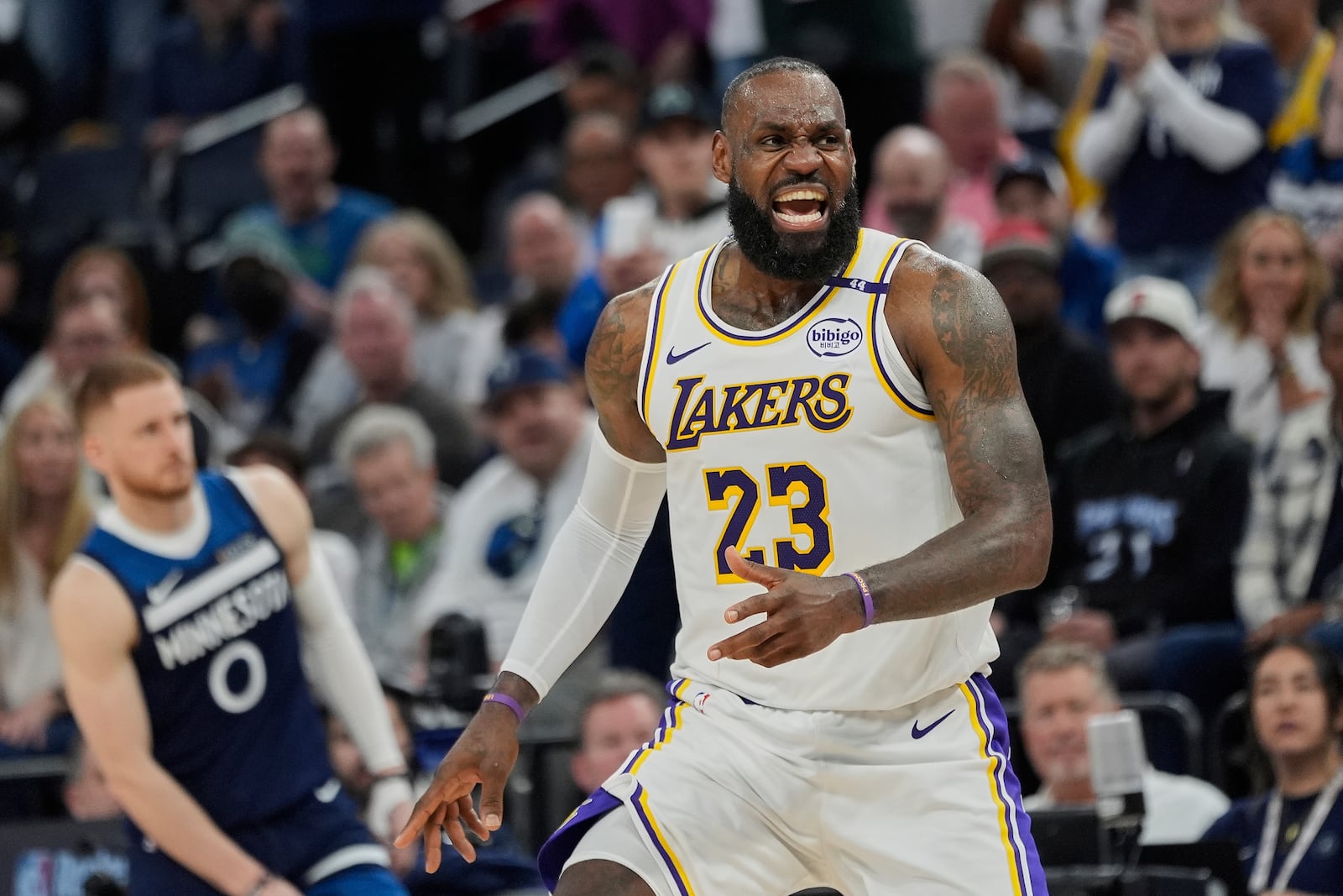 Los Angeles Lakers guard Austin Reaves (15) reacts after a call by a referee during the second half of Game 4 of an NBA basketball first-round playoff series against the Minnesota Timberwolves, Sunday, April 27, 2025, in Minneapolis. (AP Photo/Abbie Parr)